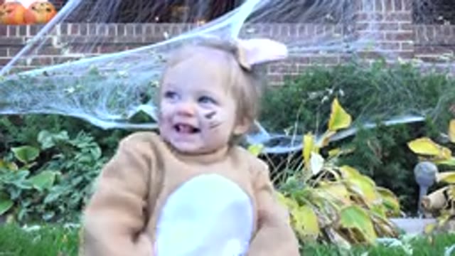 WESTMINSTER COLORADO-2015: A Small Kid Plays Outside While Dressed In A Funny Animal Costume
