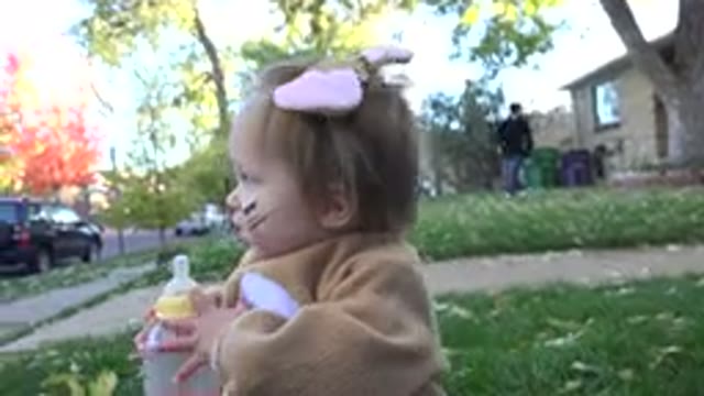 WESTMINSTER COLORADO-2015: Toddler Wearing Brown Rabbit Costume Holds Clear Bottle