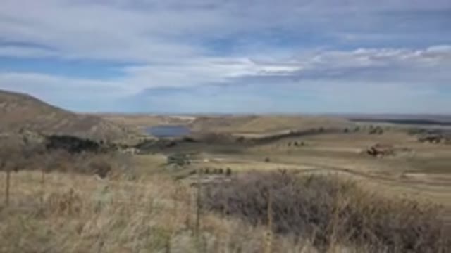 GOLDEN COLORADO-2015: A Grassy Plain Area With a Blue Sky and Clouds