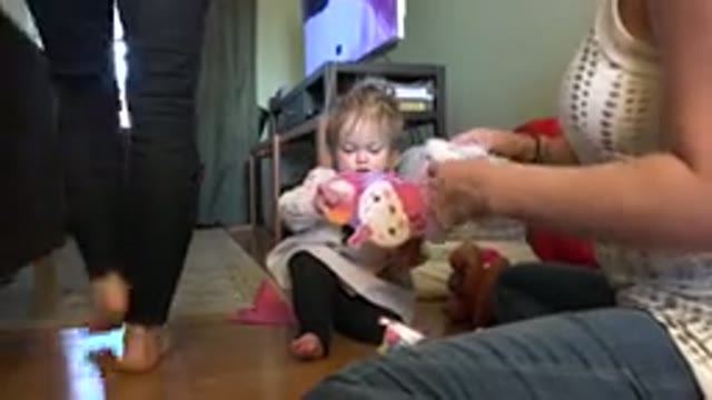 WESTMINSTER COLORADO-2015: Mother Opening Gift With Her Baby in Home