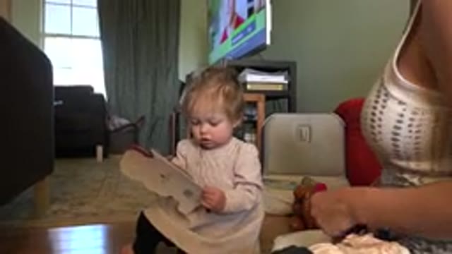 WESTMINSTER COLORADO-2015: A Child With Blonde Hair Is Holding A Paper Card As