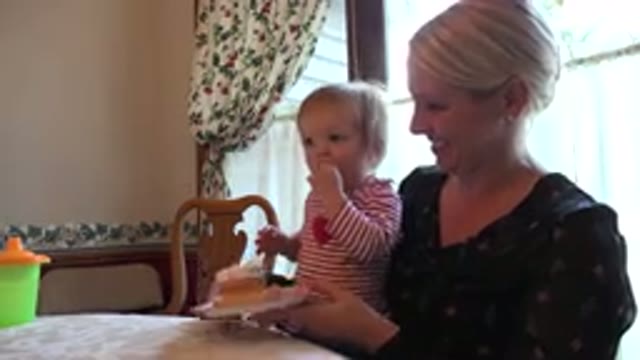 PRAIRIE GROVE ILLINOIS-2015: Mother And Messy Child Bonding Over Cupcake Topped