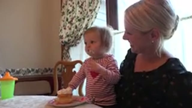 PRAIRIE GROVE ILLINOIS-2015: Mom Watching A Daughter Eat Cake Laughing A Lot And