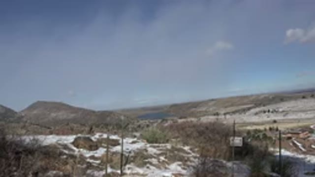 GOLDEN COLORADO-2015: Field With Dry Plants And Snow During The Day With A