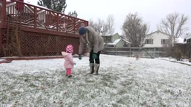 WESTMINSTER COLORADO-2015: Child Has Fun Playing With His Mother During A Winter