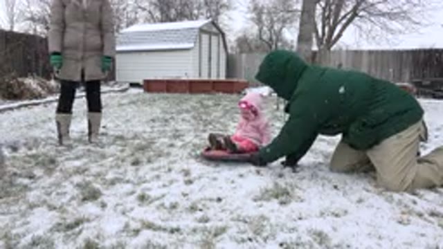 WESTMINSTER COLORADO-2015: Man Moving His Child In The Snow