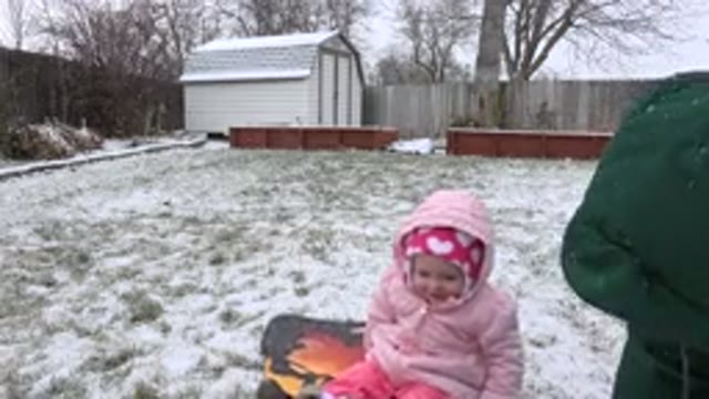 WESTMINSTER COLORADO-2015: Baby Girl Playing With Parent Outside In The Snow