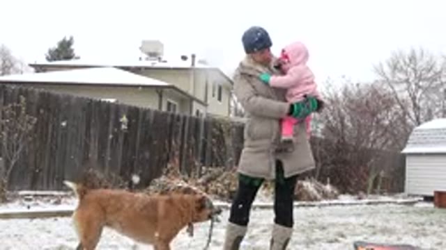 WESTMINSTER COLORADO-2015: Mom And Daughter Standing In A Yard With Snow