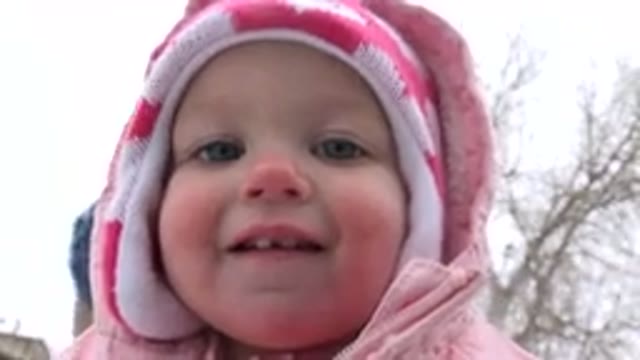 WESTMINSTER COLORADO-2015: Cute Baby Girl Playing in the Snow