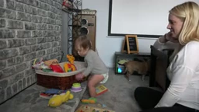 WESTMINSTER COLORADO-2015: Content Mom Watching Over Her Baby Play With Toys