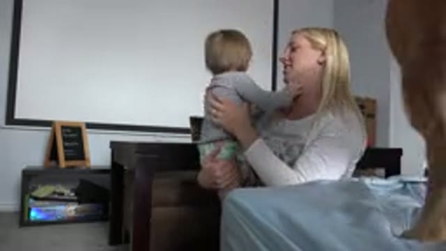 WESTMINSTER COLORADO-2015: Baby Smiling Mother Playing Dog