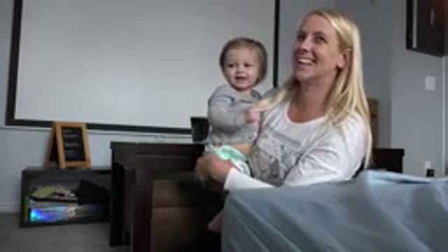 WESTMINSTER COLORADO-2015: Mother Holding Baby Looking at Someone