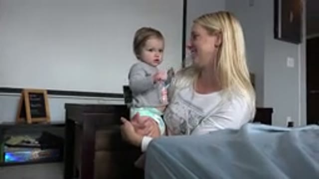 WESTMINSTER COLORADO-2015: Child Playing With Hair Of Blonde Woman