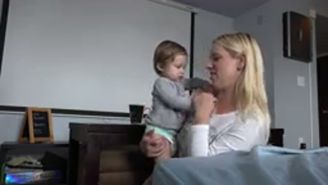 WESTMINSTER COLORADO-2015: A Toddler In The Arms Of An Older Woman Both Are In A Bedroom