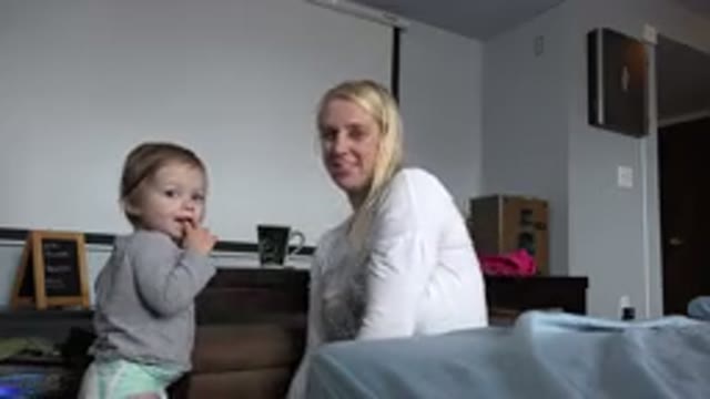 WESTMINSTER COLORADO-2015: Baby Smiling With A Dog And A Mother On A Bed