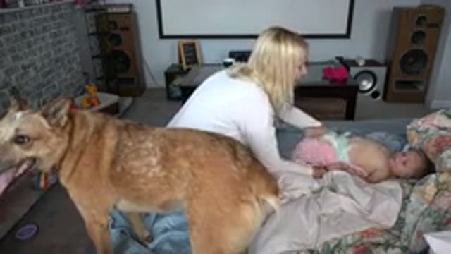 WESTMINSTER COLORADO-2015: Blonde Woman Prepares Baby To Change Diapers On The Bed
