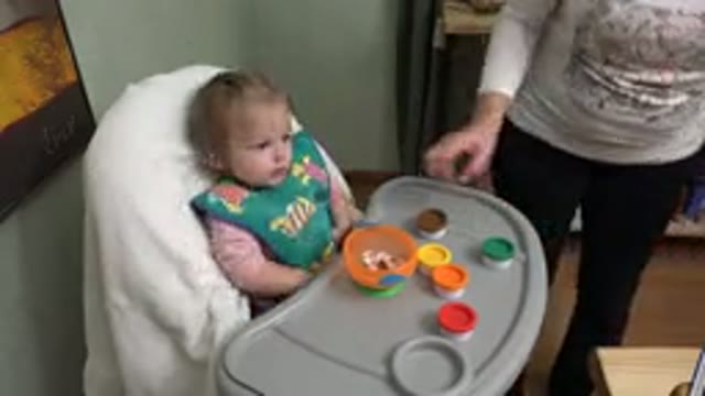 WESTMINSTER COLORADO-2015: Mother Ensures Baby Is Satisfied During Mealtime