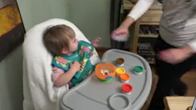 WESTMINSTER COLORADO-2015: Baby Sitting On Chair While Being Cared For By A Woman