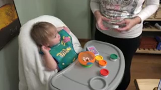 WESTMINSTER COLORADO-2015: A Mother Closes a Container of Play Dough and Moves