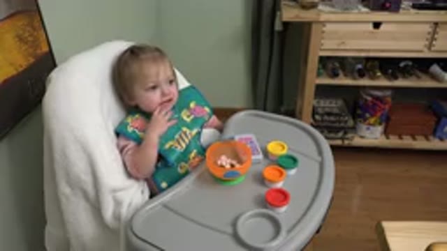 WESTMINSTER COLORADO-2015: Baby in Car Seat Eats Cereal Given by Mother