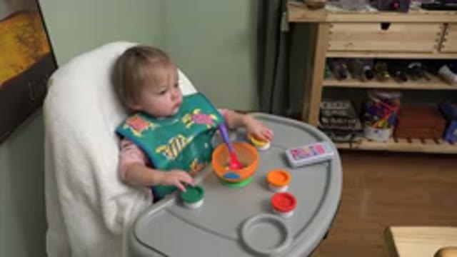 WESTMINSTER COLORADO-2015: Baby Happily Plays With Toys In High Chair