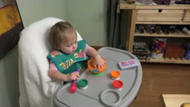 WESTMINSTER COLORADO-2015: Little Baby Eating Food With Fingers In High Chair