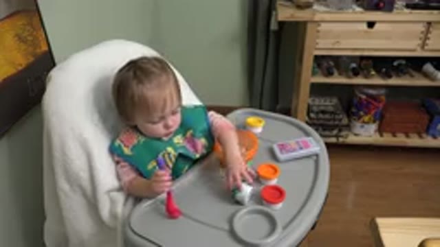WESTMINSTER COLORADO-2015: Small Baby Playing With New Toys While Sitting In