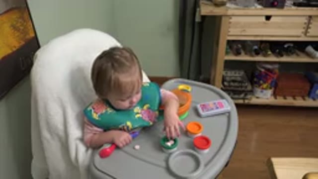 WESTMINSTER COLORADO-2015: Child Sitting In The Kitchen In Baby Chair Playing