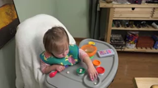 WESTMINSTER COLORADO-2015: A Child Playing With Colorful Toys On A Surface