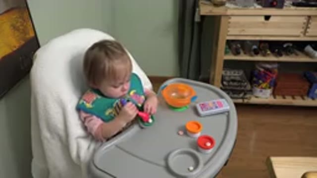 WESTMINSTER COLORADO-2015: Little Girl On A Baby Chair Playing And Learning With