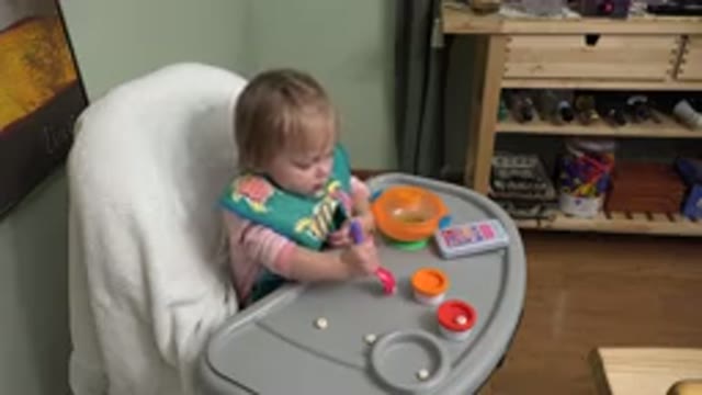WESTMINSTER COLORADO-2015: Little Child Sitting In A High Chair Trying To Pick