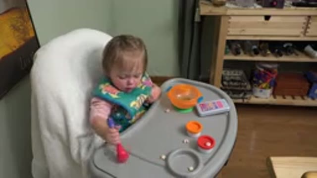 WESTMINSTER COLORADO-2015: Cute Child Sitting On Feeding Chair With Bib And Spoon