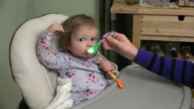 WESTMINSTER COLORADO-2015: A Baby Being Fed and Looking Out of the Corner