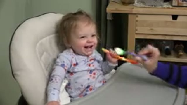 WESTMINSTER COLORADO-2015: A Little Infant Sitting In A High Chair Being Fed By