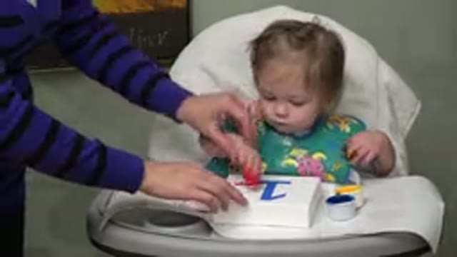 WESTMINSTER COLORADO-2015: A Caucasian Baby Sitting In A High Chair And Working