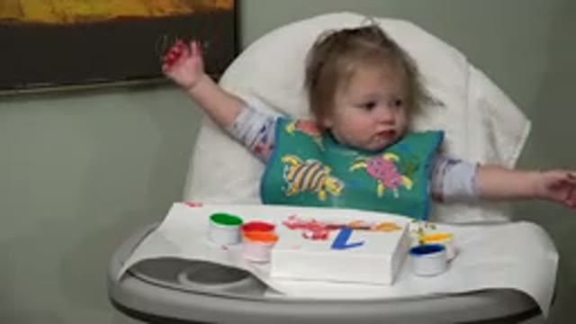 WESTMINSTER COLORADO-2015: Adorable Baby Finger Painting With Arm In Air And Smiling