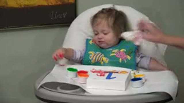 WESTMINSTER COLORADO-2015: A Baby's Mouth Being Wiped By A Napkin Held By A
