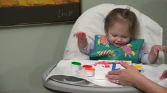 WESTMINSTER COLORADO-2015: Baby Girl Sitting In A Chair And Playing With Paint