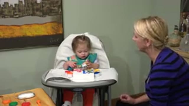 WESTMINSTER COLORADO-2015: Mother Encourages Baby Daughter to Play with Toys