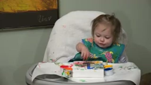 WESTMINSTER COLORADO-2015: A Little Child Making A Mess With Lots Of Paint