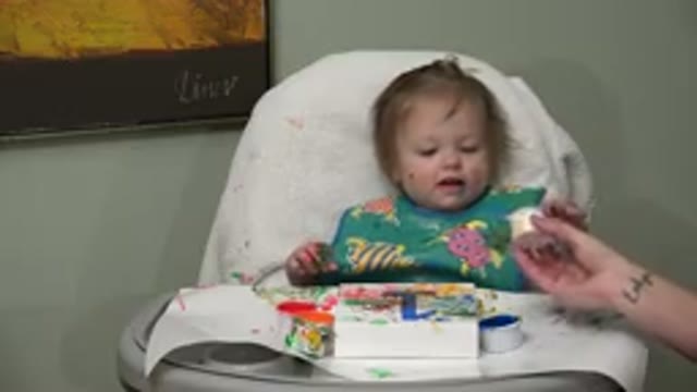 WESTMINSTER COLORADO-2015: Cute Baby Playing With Finger Paint Of Different Colors