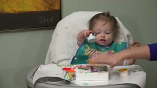WESTMINSTER COLORADO-2015: Innocent Baby Playing With Paint And Making Art With