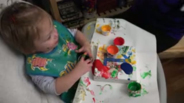 WESTMINSTER COLORADO-2015: A Toddler Playing With Paint On Her Desk Under Supervision
