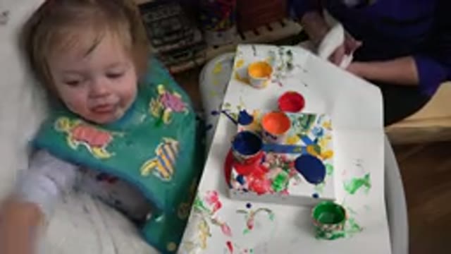 WESTMINSTER COLORADO-2015: Mother Moves Container of Blue Paint