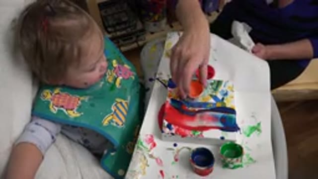 WESTMINSTER COLORADO-2015: Cute Baby Playing With Parent Using Paint
