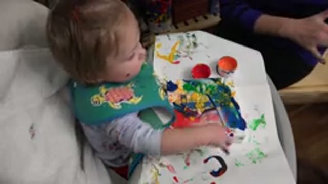 WESTMINSTER COLORADO-2015: Baby Girl With Handkerchief Playing With Multi-Colored Paints