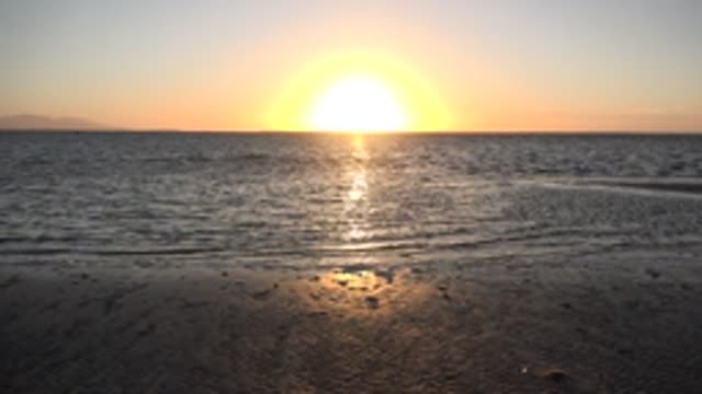 SAN CARLOS BCS MEXICO-2022: Sunset over Calm Ocean and Sandy Beach