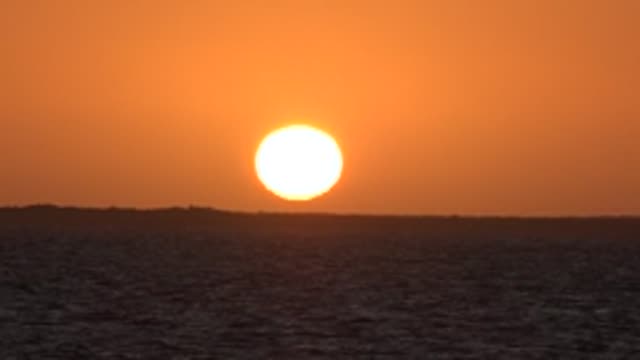 SAN CARLOS BCS MEXICO-2022: Sunset over Ocean with Gentle Water Ripples