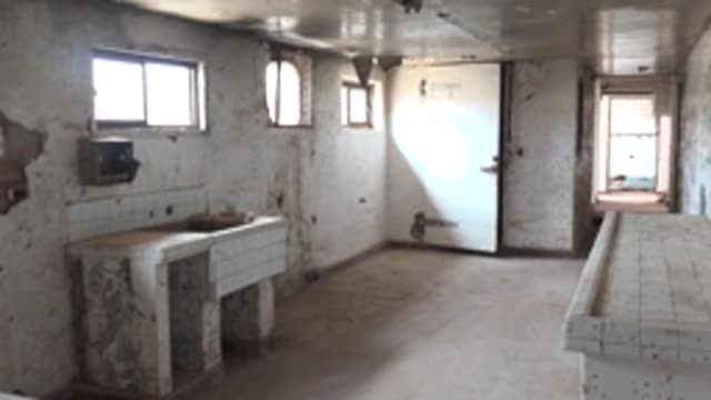 MULEGE BCS MEXICO-2022: Dilapidated Washroom with Peeling Walls and Tiled Sinks