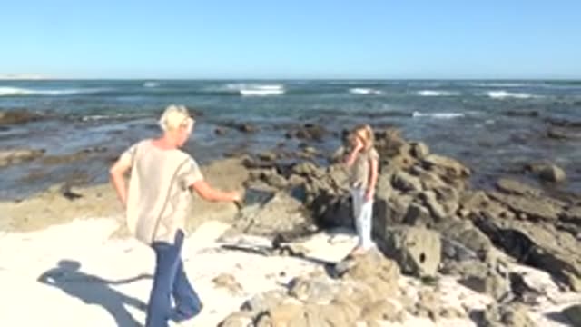 LA BOCANA BCS MEXICO-2022: Man and Child Exploring Rocky Shoreline